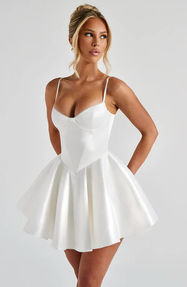 Poppy Mini Dress in Ivory showcasing a flattering fit with underwired cups and a voluminous skirt, perfect for any occasion.