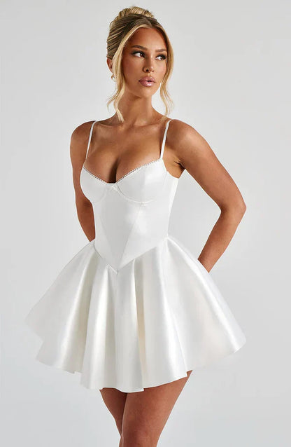 Poppy Mini Dress in Ivory showcasing a flattering fit with underwired cups and a voluminous skirt, perfect for any occasion.