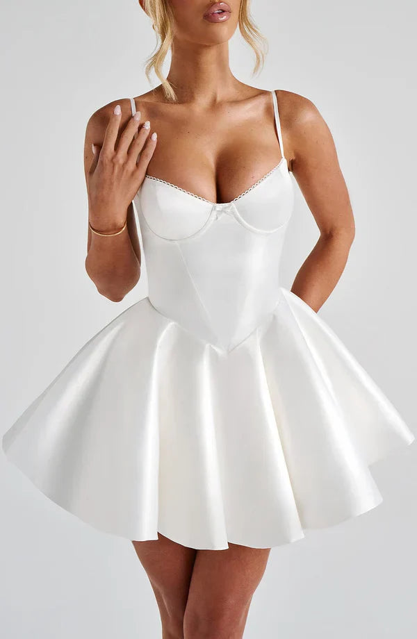 Model wearing the Poppy Mini Dress Ivory with underwired cups and a full circle skirt for a timeless look.
