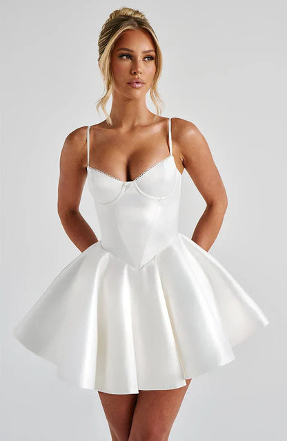 Model wearing the Poppy Mini Dress Ivory with underwired cups and a full circle skirt for a timeless look.